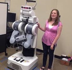 A blind lady walks with the robot as sighted guide